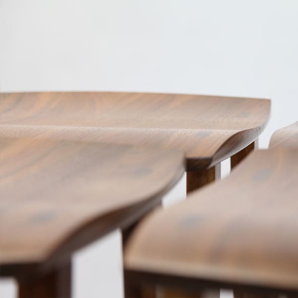 Detail of Wave Bar Stools in Blackwood.