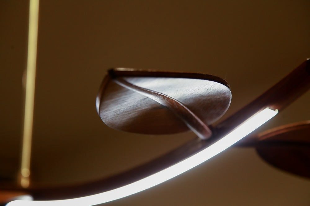 An LED hanging light in blackwood designed and made by the team at Dunstone Design.
