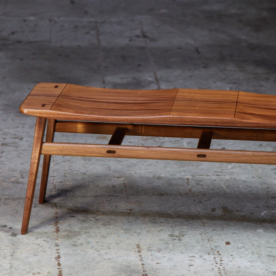 A low two seat stool designed for Australian hallways made from native timbers.
