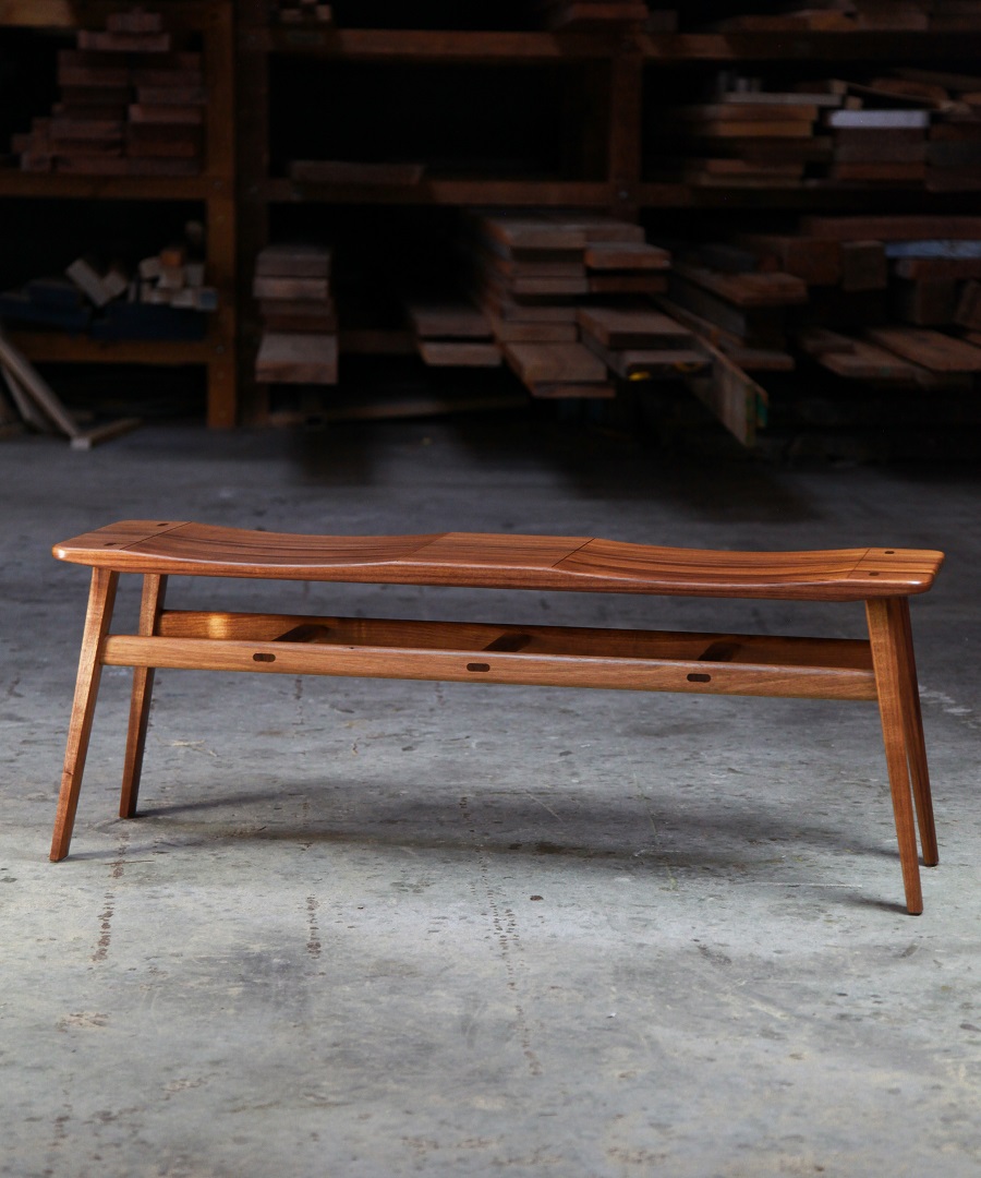 A low two seat stool designed for Australian hallways made from native timbers.