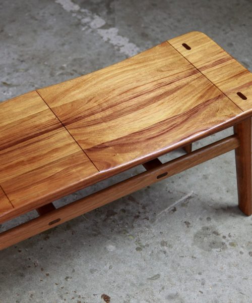 A low two seat stool designed for Australian hallways made from native timbers.