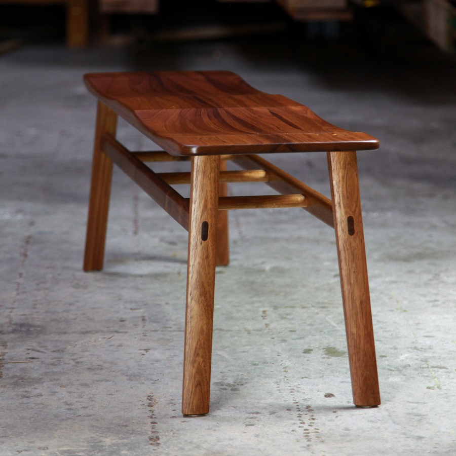 A low two seat stool designed for Australian hallways made from native timbers.