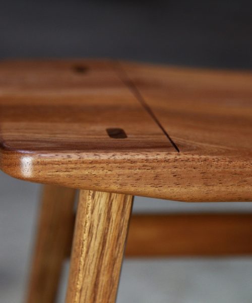 A low stool designed for Australian houses made from native timbers.