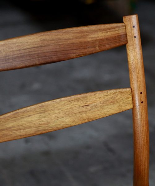 A high stool with a back rest designed for Australian houses and made from native timbers.