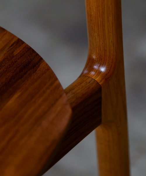 A high stool with a back rest designed for Australian houses and made from native timbers.