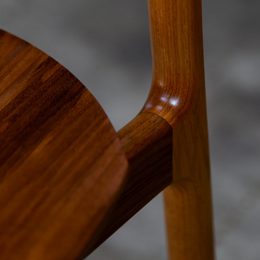 A high stool with a back rest designed for Australian houses and made from native timbers.