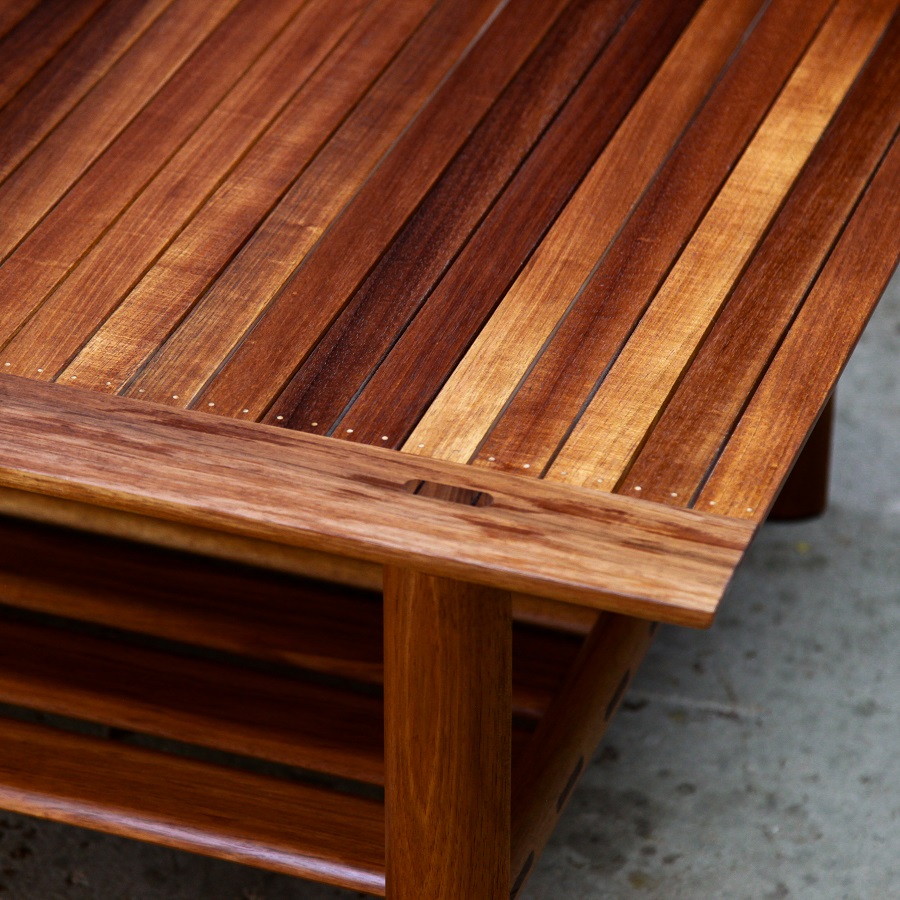 A coffee table with magazine shelf designed for Australian homes and crafted from native timbers.