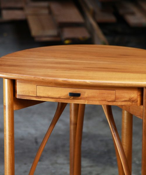 A corner table designed for Australian homes made from native timbers.