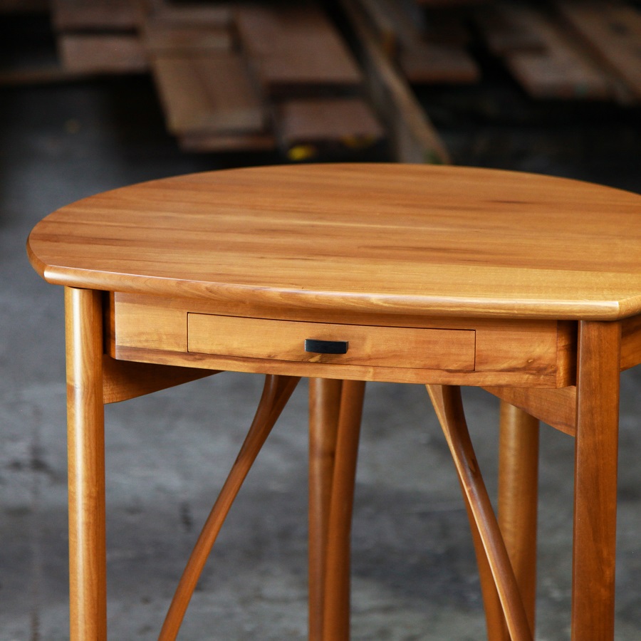 A corner table designed for Australian homes made from native timbers.