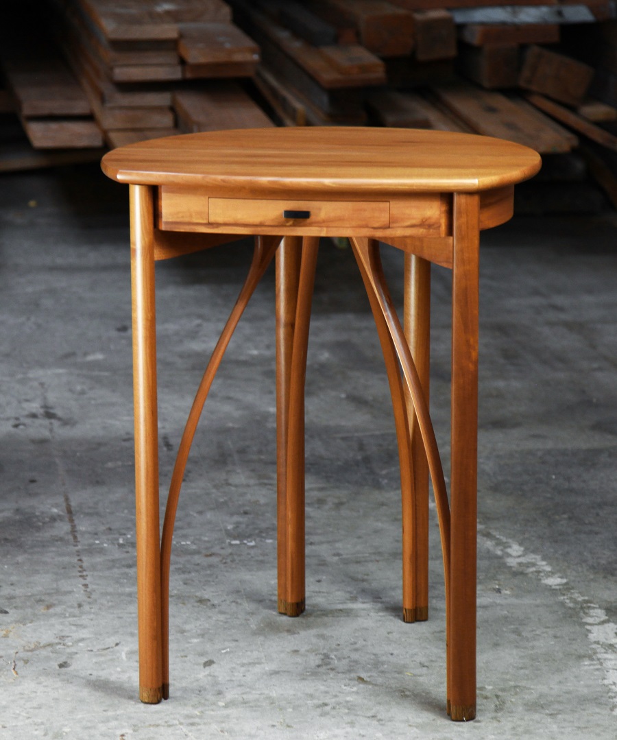 A corner table designed for Australian homes made from native timbers.
