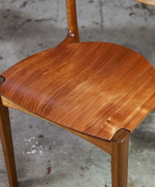 An Australian designed and made low back dining chair in Tasmanian blackwood in a woodworking workshop.