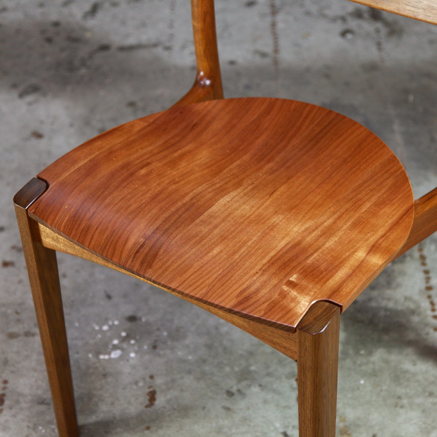 An Australian designed and made low back dining chair in Tasmanian blackwood in a woodworking workshop.