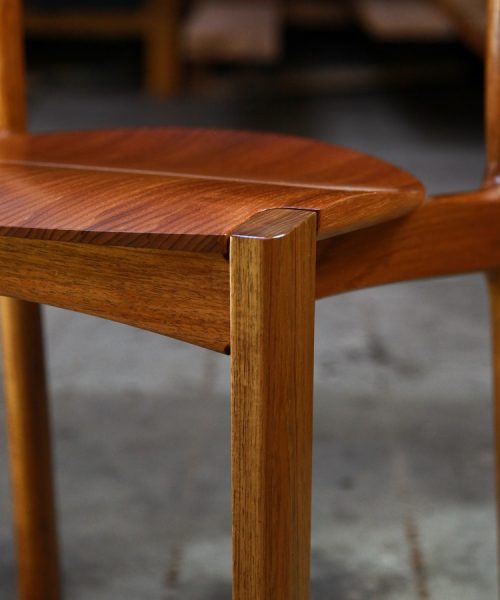 An Australian designed and made low back dining chair in Tasmanian blackwood in a woodworking workshop.