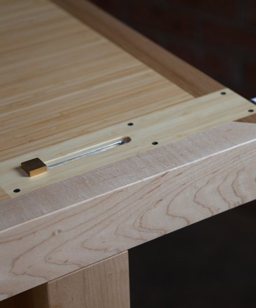 An HNT Gordon tail vice is perfectly fitted to a rock maple and bamboo workbench.