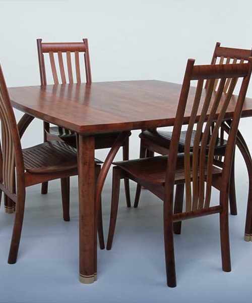 Confluence 4 seat dining table in red gum with silver ash and Clearwater chairs