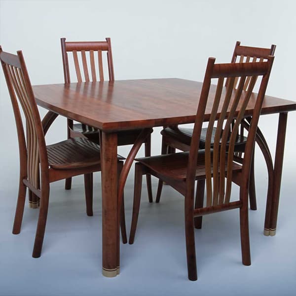 Confluence 4 seat dining table in red gum with silver ash and Clearwater chairs